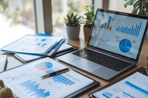 Laptop with charts in workspace conveys financial analysis environment photo