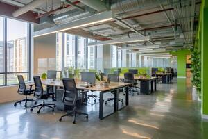 Office with glass desks, exposed ceiling, and large windows featuring industrial design photo