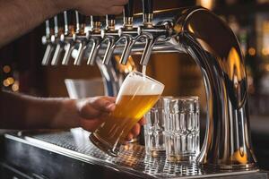 Beer Taps and Frothy Glass in Dimly Lit Bar Setting photo