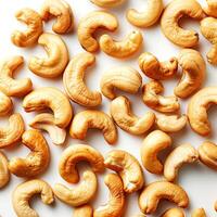 Cashew nuts pattern on white background. Top view. photo