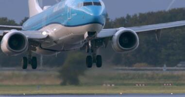 Amsterdam, Netherlands 28 August, 2024. KLM passenger airplane gracefully descending onto the runway during landing at an airport video