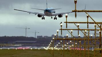 Amsterdam, Netherlands 28 August, 2024. Airplane gracefully descending onto the runway at a busy airport video