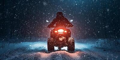 Night ATV Ride Through Snowy Forest photo