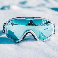 Stylish Winter Ski Goggles Reflecting a Snowy Landscape photo
