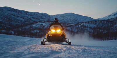 Snowmobile Adventure in Snowy Mountains at Night photo