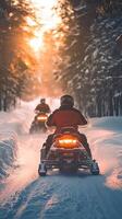 Winter Snowmobile Adventure in a Snowy Forest at Sunset photo