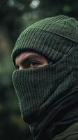 Mysterious Figure in Deep Forest Green Mask photo