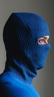 Close-up Portrait of a Person Wearing a Blue Mask photo