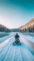Winter Adventure on a Snowmobile through Frozen Lake photo