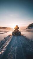 Winter Sunrise Adventure on Frozen Lake with Snowmobile photo