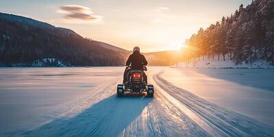 Winter Snowmobile Adventure at Sunset on Frozen Lake photo