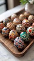 Hand Painted Easter Eggs Display on Wooden Tray photo