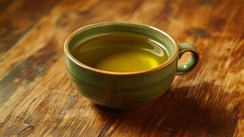 A Delicate Cup of Green Tea on Rustic Wood photo