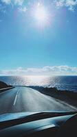 Coastal Road Trip Under Sunny Sky photo