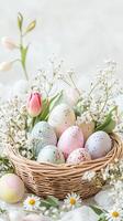 Easter Eggs in a Basket with Flowers photo