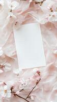Delicate Pink Floral Arrangement with Blank Paper photo