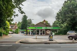 Exploring a Suburban Gas Station. Architecture, Automobiles, and the Everyday Landscape of a Quiet Community. A Serene View of Greenery and Transportation Infrastructure. photo