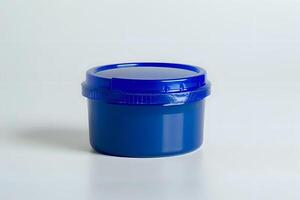 Exploring the Design and Functionality of a Simple, Round. Blue Plastic Jar with a Secure Lid, Ideal for Various Storage Needs. A Versatile Container for Everyday Use, photo