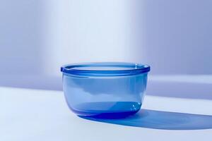 Glass Bowl Reflecting Light. A Study in Blue Hues and Shadows, Captivating Minimalist Aesthetic with Tranquil Ambiance. Exploring Color, Form, and Light in Still Life Photography. photo