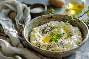 Creamy Cheese Dip Recipe. A Simple Preparation with Herbs and Spices, Drizzled with Olive Oil for Exquisite Flavor, Perfect for Snacking or Appetizers. photo