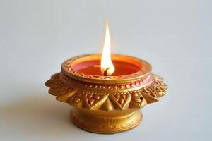Ornate Candle Holder with a Flickering Flame. A Golden Vessel Illuminates Peacefully and Serene Atmosphere, Creating a Tranquil and Reflective Mood. Symbol of Hope and Light. photo