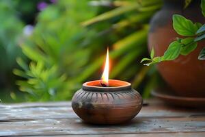 Serene Clay Lamp Illuminates Tranquil Garden Scene. A Peaceful Moment Captured in Nature's Embrace, with Glowing Flame and Rustic Pottery, Creating a Calming Atmosphere of Natural Beauty. photo