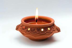 A Terracotta Candle Holder with a Burning Candle Creates a Warm and Serene Atmosphere, Perfect for Relaxation and Meditation. Embracing Tranquility through Simple Scents and Gentle Light. photo