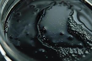 Dark Liquid Abstract. Exploring the Viscous Flow and Intricate Bubble Formations of an Unidentified Substance, Revealing a Mysterious and Captivating Deep-Sea-Like Texture with Stunning Details. photo