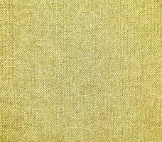 A yellow fabric background with a light green color photo