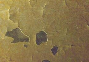 A close up of a wall with some scratches photo