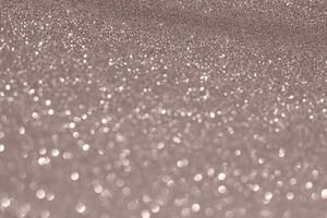 A close up of a glittery surface with a lot of sparkles photo