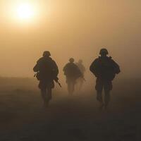 Soldiers march through a dusty landscape at sunset, creating a solemn and dramatic atmosphere during a military operation photo