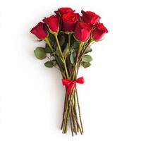 Beautiful bouquet of red roses arranged elegantly with green leaves and a red ribbon for special occasions such as anniversaries or Valentine's Day photo
