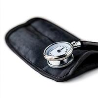 Blood pressure cuff and gauge used for measuring vital signs in a clinical setting photo