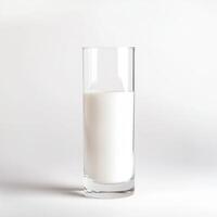 Tall glass filled with fresh milk against a simple background in a well-lit setting photo