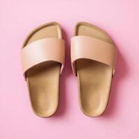 Stylish open-toe sandals on a pink background ideal for summer fashion and casual wear photo
