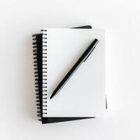 Blank notebook and black pen ready for creative ideas and notes on a clean surface photo