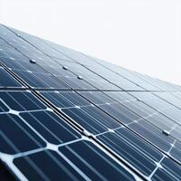 Solar panels reflecting sunlight against a clear sky in a renewable energy installation photo