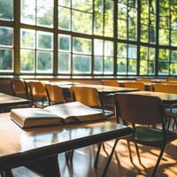 Quiet classroom with sunlight streaming through large windows in the afternoon photo