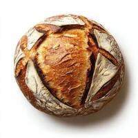 Freshly baked round sourdough bread with a golden crust and artistic scoring design on a clean white background photo
