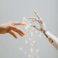 Human and robotic hands reaching out to connect, showcasing the fusion of technology and humanity photo