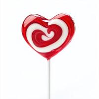 Colorful heart-shaped lollipop with red and white swirls perfect for celebrations and sweet treats photo