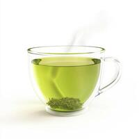 Hot green tea in a transparent cup with steam rising in a cozy indoor setting during the afternoon photo