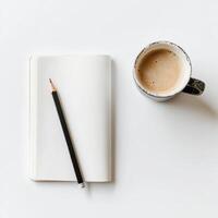 Cozy workspace with a blank notebook and a steaming cup of coffee captured in natural light during a morning routine photo