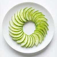 Cucumber slices arranged in a circular pattern on a white plate for a fresh and healthy presentation photo