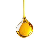 Golden liquid drips gracefully from a spoon, showcasing its smooth texture and rich color photo