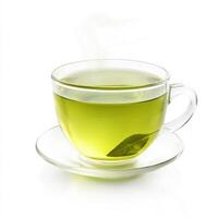 Green tea steaming in a clear glass cup on a white surface creates a serene and calming ambiance in a minimalist setting photo