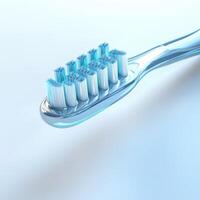 Close-up view of a modern toothbrush with blue bristles on a soft background photo