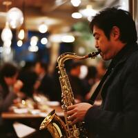 Jazz musician plays saxophone in a lively restaurant during an evening performance photo