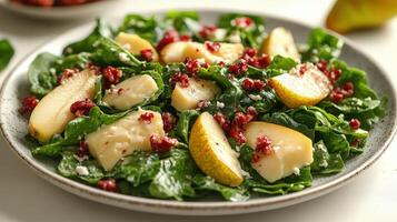 A vibrant salad of spinach, juicy pears, and tart cranberries for a refreshing taste photo